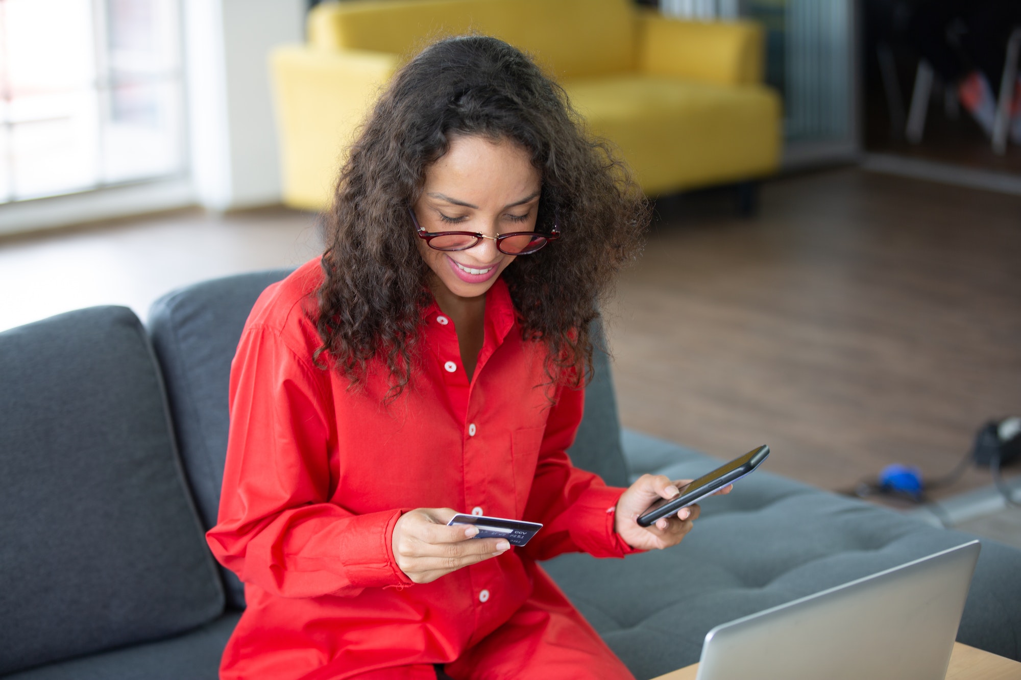 African American business freelance woman working at home with online communication using laptop